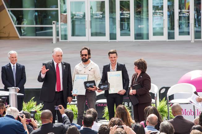 The Killers' Ronnie Vannucci and Brandon Flowers receive keys to The Strip during a press conference for the T-Mobile Arena's opening day celebration; Wed. April 6; 2016.
