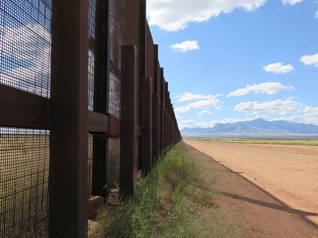 This Wednesday, Sept. 16, 2015, photo shows a part of the border fence near Naco, Ariz., during a tour of the border hosted by the Cochise County Sheriff's Office.