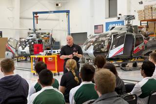 Greg Rochna, founder and president of Maverick  Aviation, speaks to students from Rancho High School's aeronautics program during a tour of Maverick's Henderson Executive Airport facility, Friday April 8, 2016.
