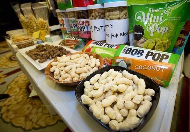 Kim's Bob Pop snacks displayed during the CinemaCon trade show at Caesars Palace Wednesday, April 13, 2016. The healthy multigrain puff is "popped" without oil and comes in a variety of flavors. The snack is made with brown rice, quinoa, millet, flaxseed and corn.