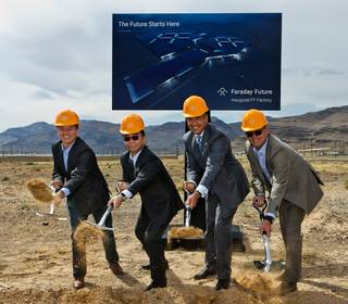 Tom Wessner of Faraday Future, Ding Lei of China’s LeEco, Gov. Brian Sandoval and Dag Reckhorn of Faraday Future throw the first shovels of dirt Wednesday, April 13, 2016, during the Faraday Future groundbreaking.