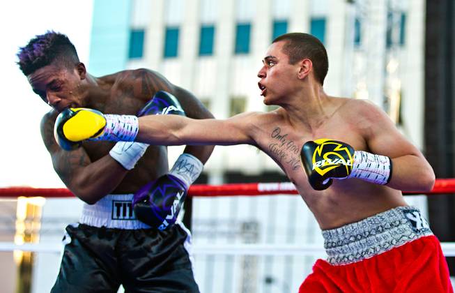 Junior Lightweight Matt Murphy is tagged by a punch from Sal Lopez during Knockout Night at the D from the Downtown Las Vegas Events Center on Friday, April 15, 2016.