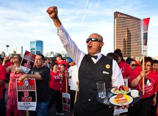 Trump International Hotel Las Vegas workers and other union supporters listen to speeches after marching down Las Vegas Blvd. to the hotel to convince their boss to start contract negotiations after they won a unionization vote on Wednesday, April 20, 2016.