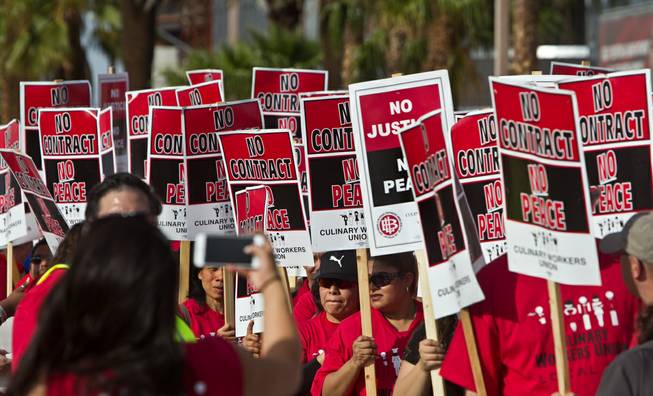 Trump International Hotel Las Vegas workers and other union supporters ready to march down Las Vegas Blvd. to convince their boss to start contract negotiations after they won a unionization vote on Wednesday, April 20, 2016.