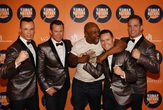 Mike Tyson is flanked by Human Nature at the grand opening of Human Nature’s “Jukebox” on Thursday, April 21, 2016, at the Venetian.