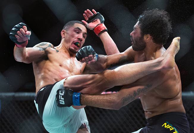 Middleweight Robert Whittaker drives a kick to the head of  Rafael Natal during their UFC 197 match at the MGM Grand Garden Arena on Friday, April 23, 2016.