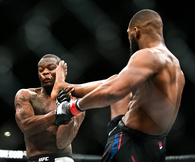 Light Heavyweight Ovince St. Preux takes a kick to the face from Jon Jones during their UFC 197 match at the MGM Grand Garden Arena on Friday, April 23, 2016.
