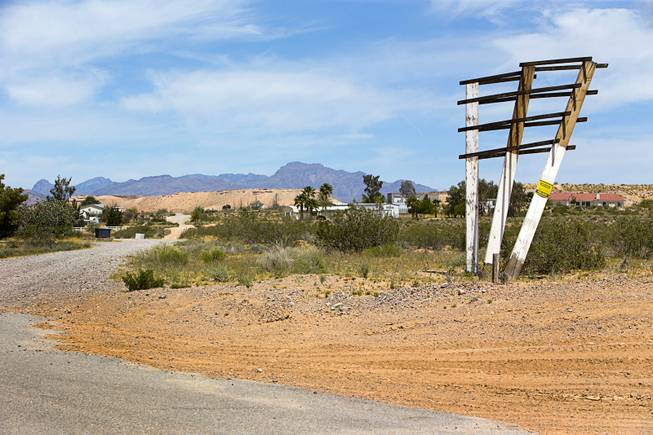 The remains of what was a sign for a future Beazer Homes development is shown on Whipple Avenue in Wednesday, May 4, 2016, in Moapa Valley.