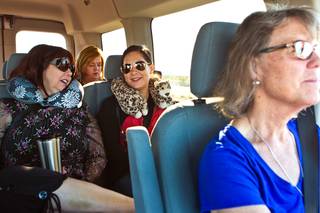 Helen Knight, right, drives a group of her teaching colleagues to Baker, Calif., to work on Tuesday, May 3, 2016. The group departs every weekday morning from Las Vegas at 6 a.m. for the commute to Baker. In the seat behind Knight are Roxanne Lang, left, and Tina Delgadillo. In the rear seat is Stacy Hertig. 