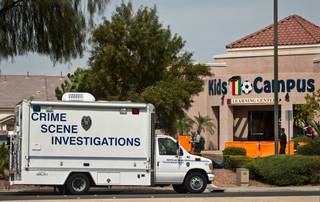 North Las Vegas Police and the Clark County Coroner's office continue to work the scene of a double murder outside of the Kids Campus Learning Center at 3901 North Martin L. King Boulevard on Thursday, May 5, 2016.