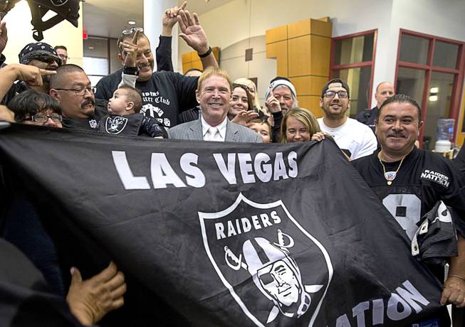 Oakland Raiders owner Mark Davis stands with local Raiders fans after a meeting of the Southern Nevada Tourism Infrastructure Committee on Thursday, April 28, 2016, at UNLV.
