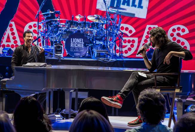 Dave Grohl, right, of The Foo Fighters interviews Planet Hollywood ...