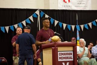 Brandon Marshall of the Denver Broncos, and former student of Cimarron-Memorial HS, speaks to students during a school assembly, Friday May 13, 2016. Cimarron-Memorial is  honoring the superbowl champion by retiring his jersey, number 21.