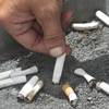 In this June 22, 2012, file photo, a smoker snuffs out a cigarette at the Capitol in Sacramento, Calif. In this June 22, 2012, file photo, a smoker snuffs out a cigarette at the Capitol in Sacramento, Calif.