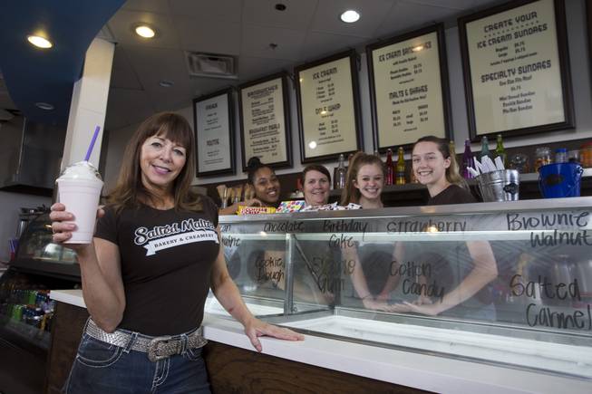 Owner Cait Messina poses with a strawberry malt at Salted Malted Bakery & Creamery, 6584 N. Decatur Blvd., Tuesday, May 17, 2016. Behind the counter, from left, are: Jhezmin Rasberry, Jill Beausoleil, head baker, Madi Williams, and Cassidy McLaws. The restaurant offers many Canadian specialties such as poutine, peameal bacon, and a variety of sweets.