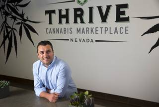 Mitch Britten, CEO of Thrive Cannabis Marketplace, poses at the medical marijuana dispensary, Tuesday, May 17, 2016.
