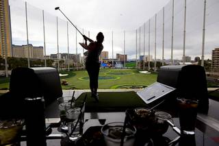 Allie Romer drives off the third level during friends and family day at Topgolf Las Vegas Tuesday, May 17, 2016. Topgolf Las Vegas, the company's flagship property, will open to the public at 8 a.m. Thursday.
