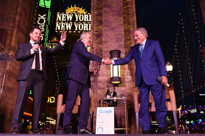 Keep Memory Alive Co-founder and Chairman Larry Ruvo shakes hands with Tony Bennett during a celebration of Keep Memory Alive's 20th annual Power of Love gala honoree Bennett's 90th birthday Thursday, May 19, 2016, at New York New York. On the left is Mark Shunock from Mondays Dark.