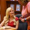 Holly Madison talks with a fan during a book signing to promote her new book "The Vegas Diaries" on Friday, May 20, 2016, at a Las Vegas Barnes & Noble.
