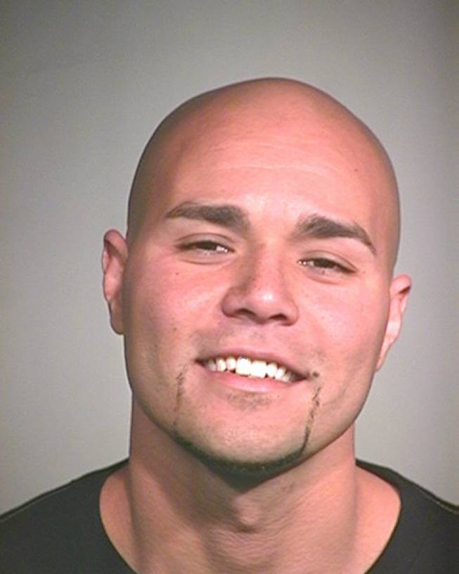 This undated booking photo provided by the Arizona Department of Corrections shows James D. Walker. Officials said Walker was armed with a rifle and body armor, opening fire at cars on a highway in the outskirts of Phoenix  on Wednesday, May 25, 2016, before police captured him near a stolen car that crashed into a ditch.