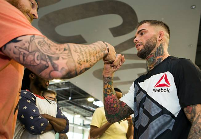 Bantamweight Cody Garbrandt greets fans during the UFC Fight Night workouts at the Las Vegas Harley Davidson store on Thursday, May 27, 2016.