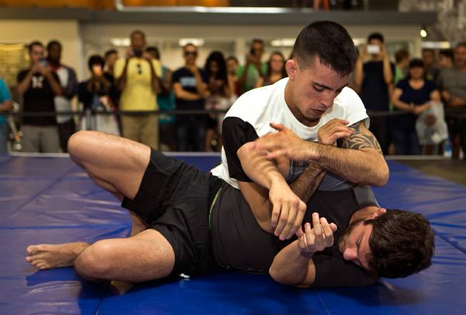 Bantamweight Thomas Almeida (above) dominates his trainer on the mat during the UFC Fight Night workouts at the Las Vegas Harley Davidson store on Thursday, May 27, 2016.