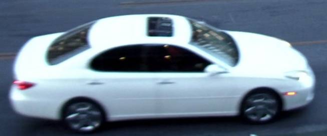 The vehicle two suspects were seen driving away in after a shooting downtown Sunday, May 29, 2016, is seen in this surveillance footage. The white, four-door sedan has dark tint and a sunroof.