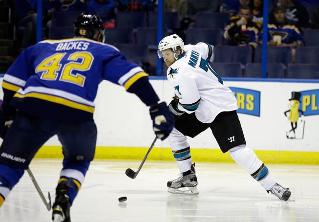 San Jose Sharks defenseman Paul Martin, right, skates against St. Louis Blues center David Backes on Sunday, May 15, 2016, during the second period of Game 1 in the NHL hockey Stanley Cup Western Conference finals in St. Louis. 