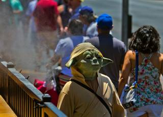 A street character continues his quest during the first 100-degree day in Las Vegas this season on Wednesday, June 1, 2016.