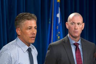 Metro Police Lt. Dan McGrath, left, responds to a question from a reporter as Lt. Jack Clements looks on during a news conference at Metro Police headquarters Monday, June 6, 2016. Police are asking for public support in solving a string of armed robberies.