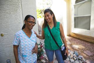 Congressional candidate Lucy Flores, right, talks with resident Linda Joyce as she canvasses in a neighborhood in North Las Vegas, Tuesday, June 7, 2016.