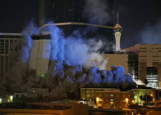 The Monaco Tower at the Riviera Hotel and Casino crumbles to the ground during a controlled demolition, Tuesday, June 14, 2016, in Las Vegas. The casino opened in 1955 and was closed last year to make room to expand the Las Vegas Convention Center.