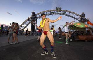 Christopher Ysais of Houston, Texas, dances by the entrance to Kinetic Field during the third night of the Electric Daisy Carnival on Sunday, June 19, 2016, at Las Vegas Motor Speedway.