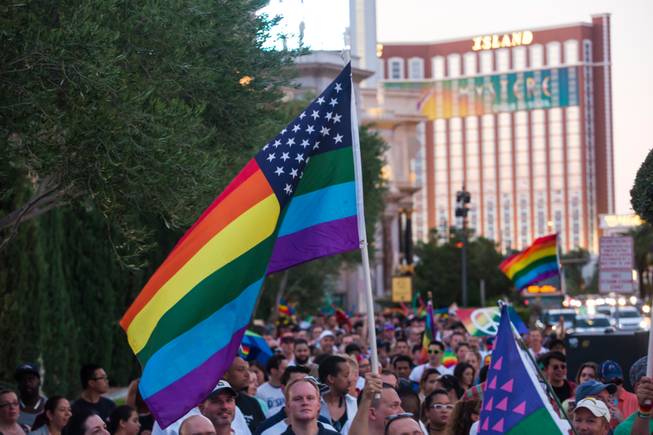 More than 1,000 members of the community walk down the Las Vegas Strip on Monday, June 20, 2016, to show solidarity for our LGBT community and honor the victims of Orlando.