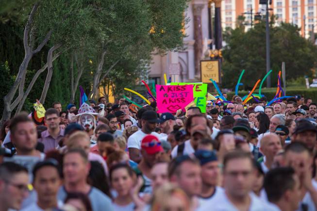 More than 1,000 members of the community walk down the Las Vegas Strip on Monday, June 20, 2016, to show solidarity for our LGBT community and honor the victims of Orlando.