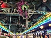 Early Saturday evening, customers shuffled in and out of Mermaids and La Bayou in downtown, being greeted at the entrances with girls placing beads around their necks. It seemed like a typical weekend night on the Fremont Street Experience. But ...