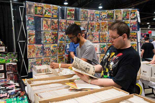 Comic collectors search through various books for sale during The Amazing Las Vegas Comic Con 2016, at the Las Vegas Convention Center, Friday June 17, 2016.