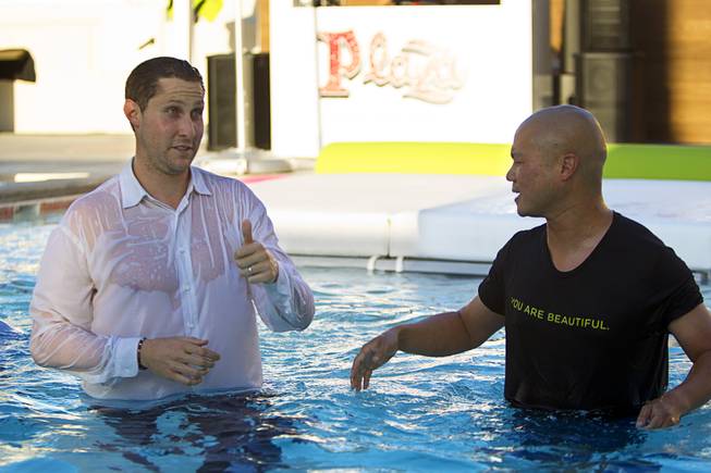 Jonathan Jossel, left, CEO of the Plaza, gives a thumbs up after jumping into the pool with Zappos CEO Tony Hsieh, right, and others during a preview event for the new rooftop pool at the Plaza in downtown Las Vegas Thursday, June 23, 2016. The pool officially opens on July 2.
