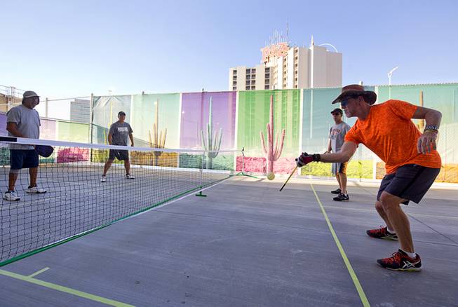 Members of the USA Pickleball Association (USAPA) play pickleball during a preview event for the new rooftop pool at the Plaza in downtown Las Vegas Thursday, June 23, 2016. In addition to the pool area the roof will have 16 courts dedicated to pickleball. The pool officially opens on July 2.