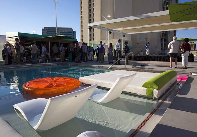 Frankie Scinta, center, sings during a preview event for the new rooftop pool at the Plaza in downtown Las Vegas Thursday, June 23, 2016. The pool officially opens on July 2.