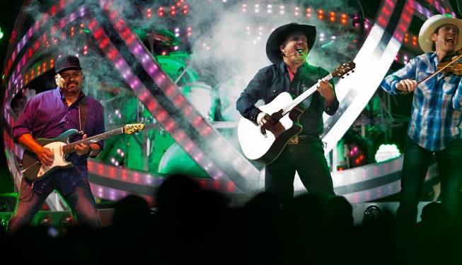 Garth Brooks takes the stage to perform with his band at the T-Mobile Arena on Friday, June 24, 2016.