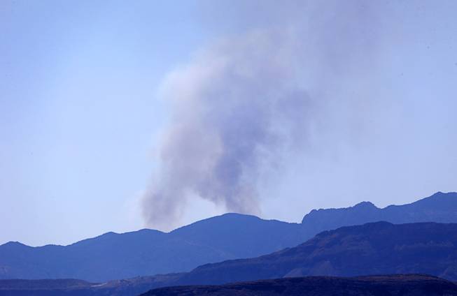 Smoke from a brush fire near Lovell Canyon Road and State Route 160 can be seen from Las Vegas Sunday, June 26, 2016.