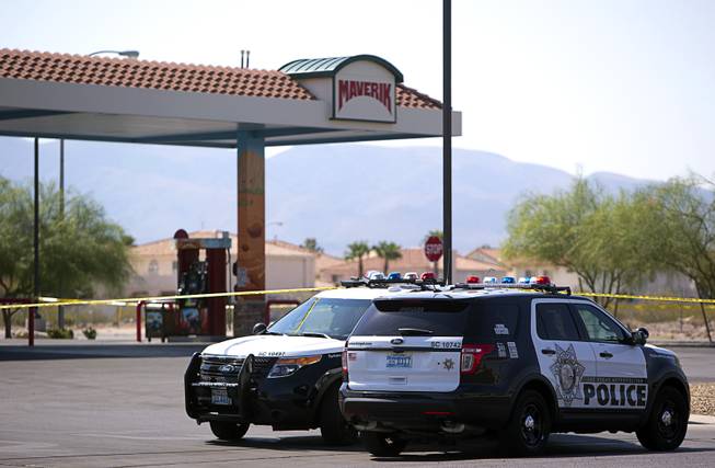 Metro Police vehicles are shown in front of the Maverik gas station at Bermuda Road and Cactus Avenue after a fatal shooting Sunday, June 26, 2016. 
