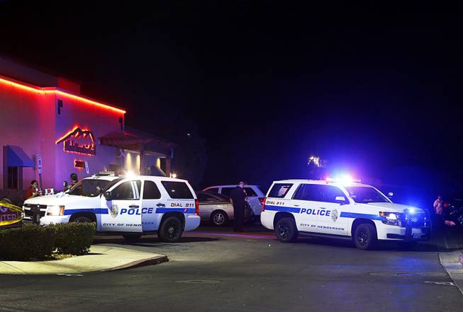 Henderson Police vehicles are shown after a shooting near the Black Mountain Grill in Henderson Monday, June 27, 2016.