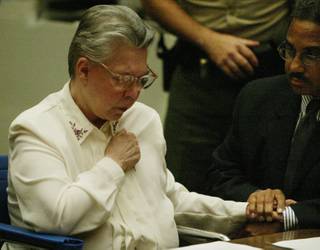 Convicted murderer Sante Kimes, 71, clutches the hand of her attorney Ray Newman as she is found guilty of the first-degree murder of David Kazdin, Wednesday, July 7, 2004, in a Los Angeles County Superior Courtroom. Kimes, who along with her son Kenneth Kimes have already been convicted of killing an elderly New York socialite, was found guilty of orchestrating the murder of David Kazdin. 