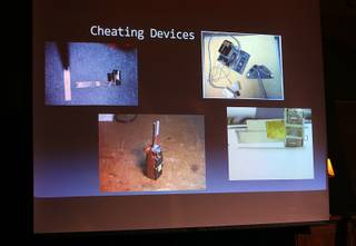 Photos of cheating devices are shown during a panel discussion on slot cheats at the Mob Museum in downtown Las Vegas Tuesday, June 28, 2016.
