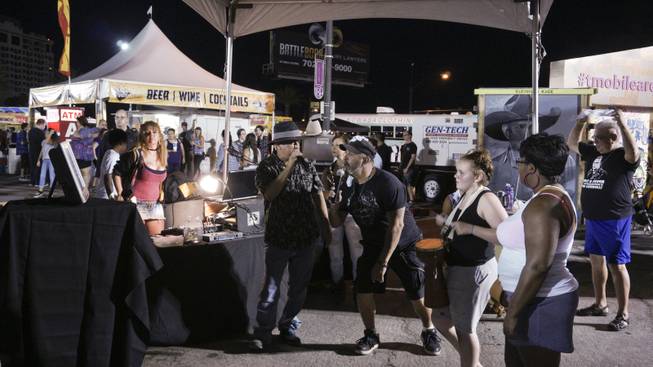 Attendees karaoke during First Friday festivities at the Arts District in downtown Las Vegas, July 1, 2016.