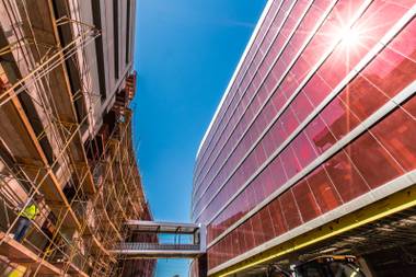 Sunlight illumnates the signature red glass windows of the hotel suites during an under-construction media tour of the Lucky Dragon Hotel and Casino, 300 W. Sahara Ave., in Las Vegas, July 7, 2016.