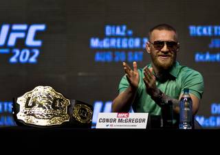 UFC fighter Conor McGregor answers a reporter's question during the announcement of fighting in UFC 202 from the T-Mobile Arena as part of Fight Week on Thursday, July 7, 2016.  .