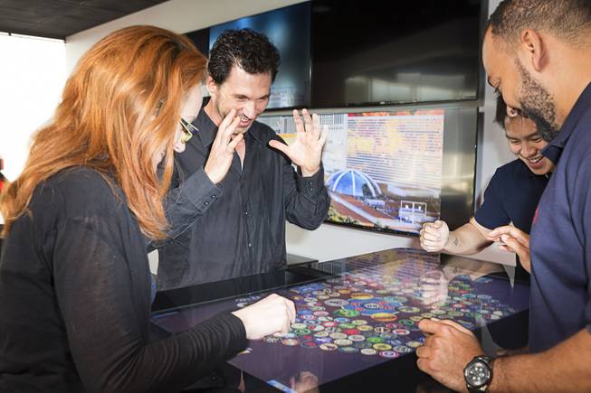Eric Meyerhofer, second from left, the chief executive of Gamblit Gaming, which makes skill-based games for casinos, playing Brew Caps League with Elizabeth Henifin, left, Nathan Ting, second from right, and Aaron Allen in Glendale, Calif., July 5, 2016. Resorts in Nevada, New Jersey and elsewhere are exploring video game gambling as a way to lure younger visitors to the casinos. 